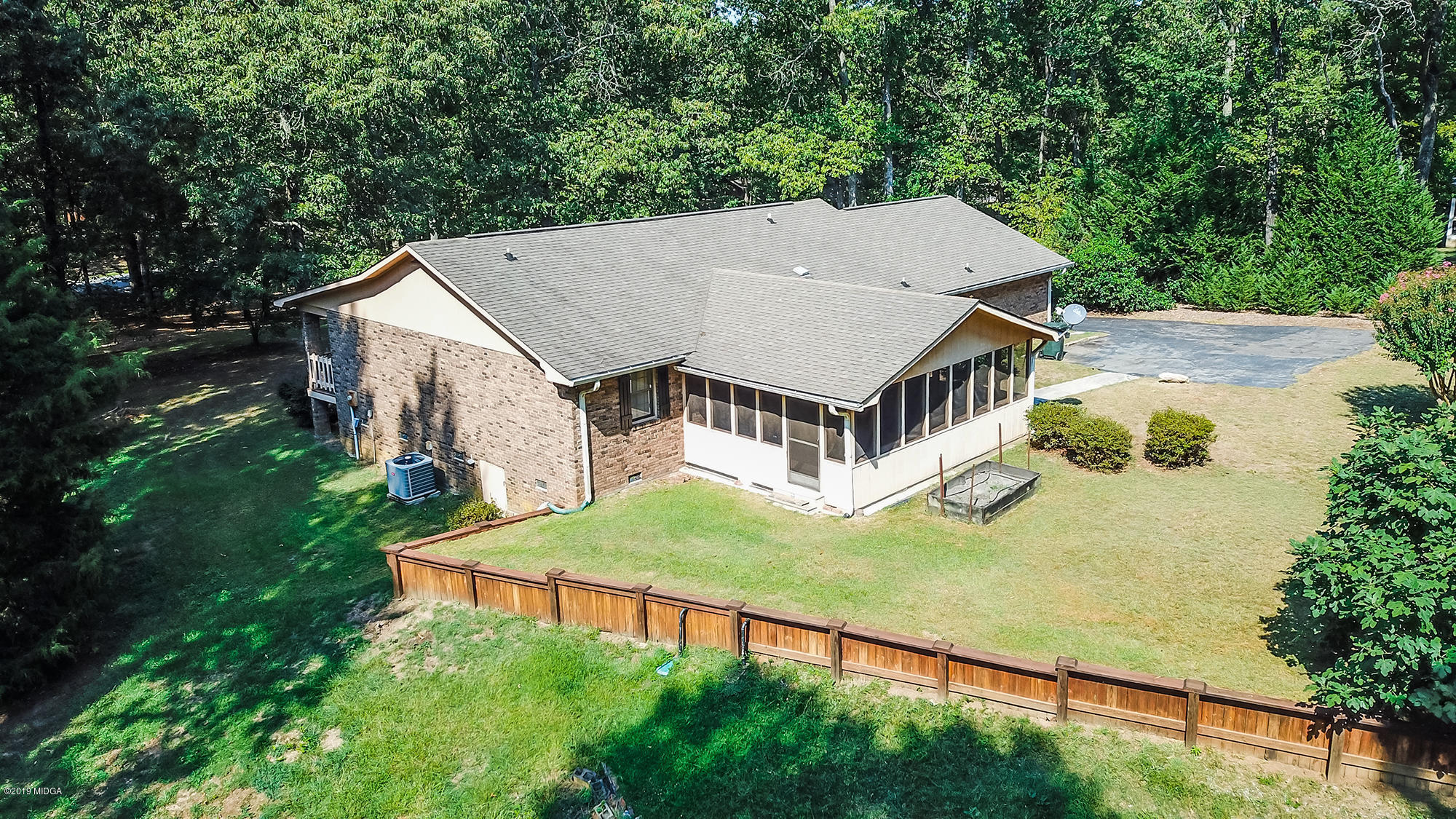 231 Red Oak Road Byron, GA 31008 - Photo 8 of 42 an aerial view of a house with swimming pool and big yard