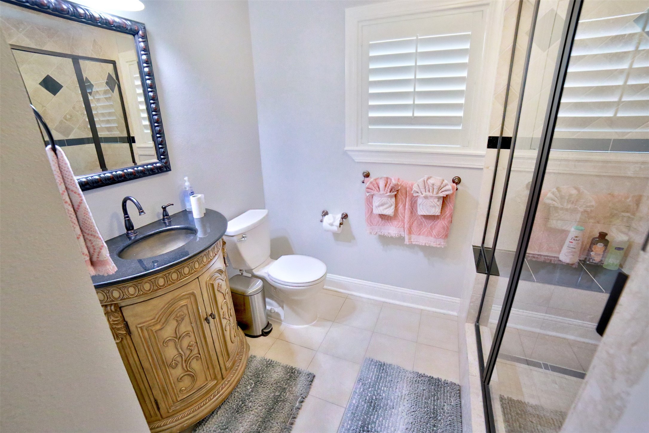2625 Peckham Street Houston, TX 77098 - Photo 22 of 27 a bathroom with a sink and a mirror