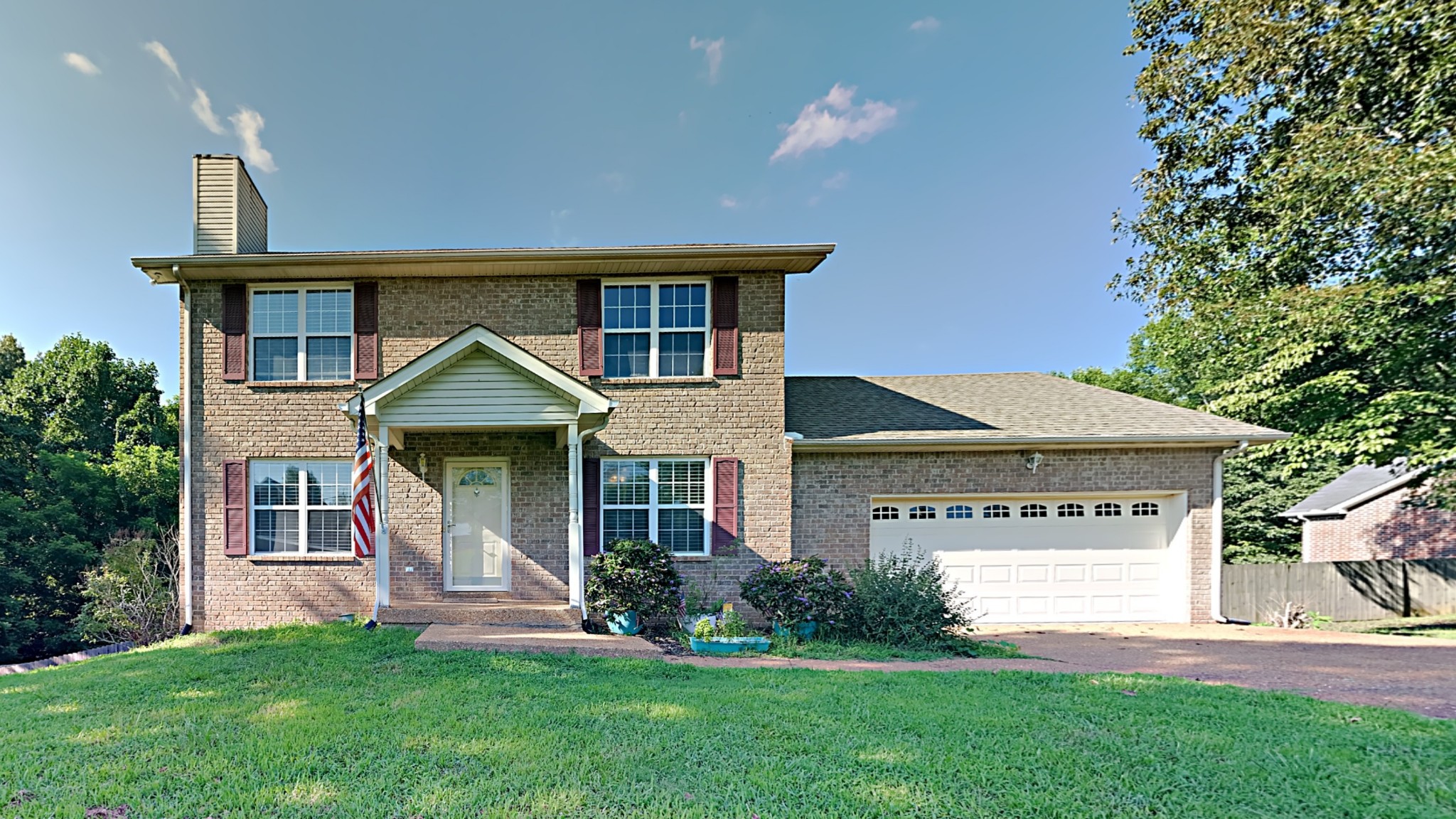 7528 Cherokee Hills Road Fairview, TN 37062 - Photo 1 of 22 a front view of a house with a yard and porch
