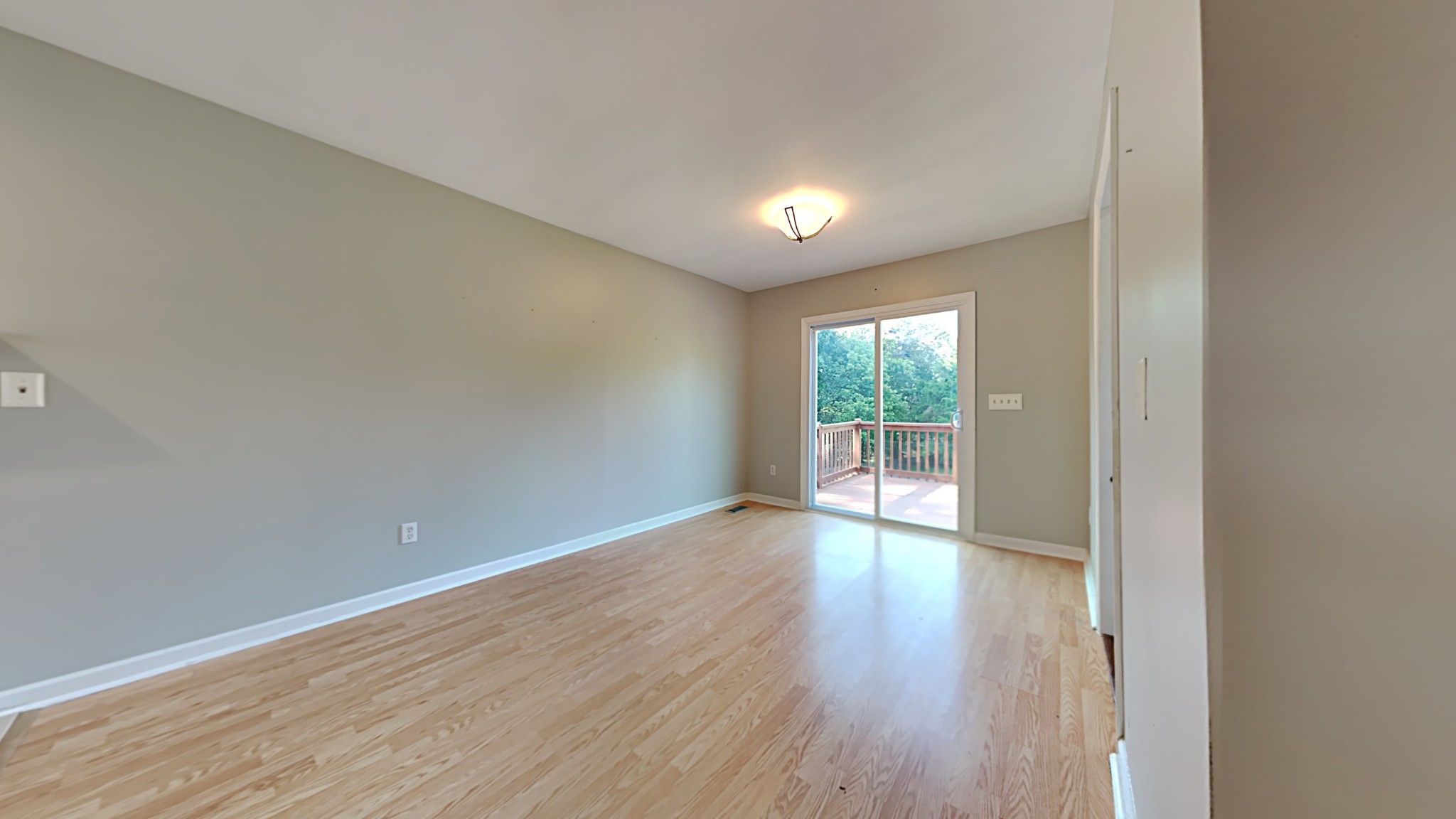 7528 Cherokee Hills Road Fairview, TN 37062 - Photo 3 of 22 a view of empty room with wooden floor and fan