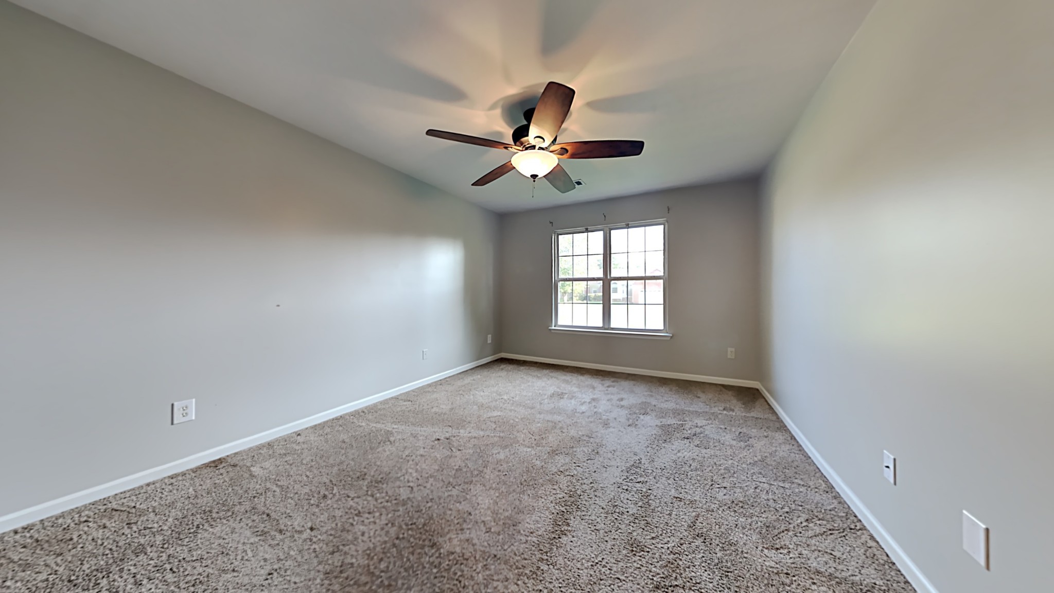 7528 Cherokee Hills Road Fairview, TN 37062 - Photo 8 of 22 an empty room with windows and ceiling fan