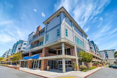 a front view of a building with large windows
