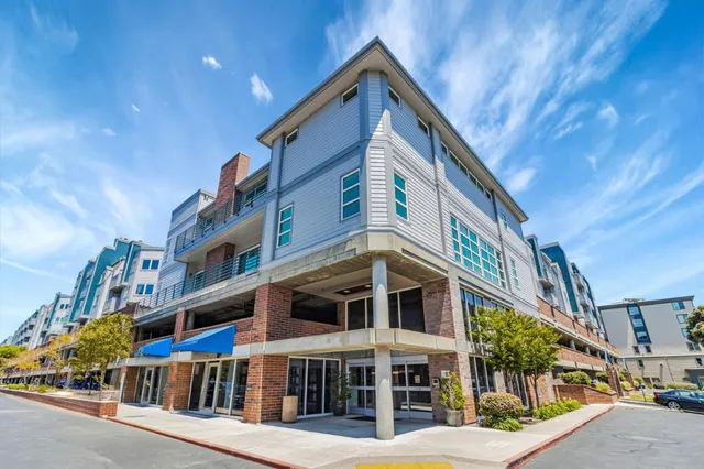 a front view of a building with large windows
