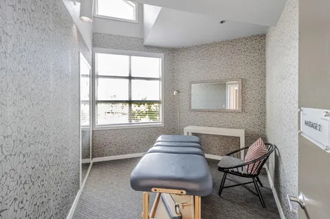 a view of a livingroom with furniture and window