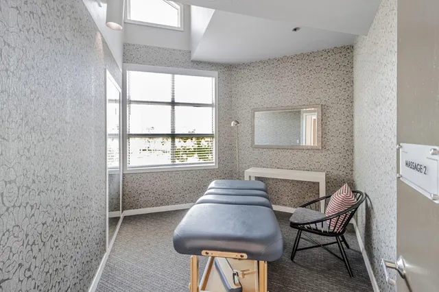 a view of a livingroom with furniture and window