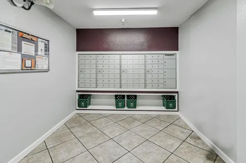 a view of an empty room with windows