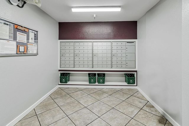 a view of an empty room with windows