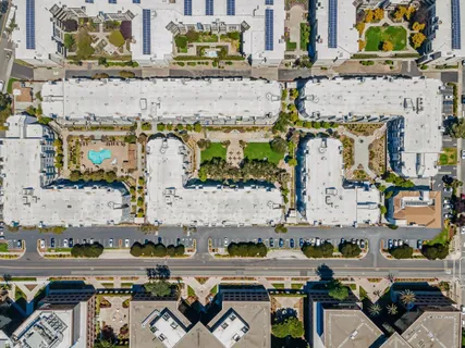 an aerial view of a house with a ocean view