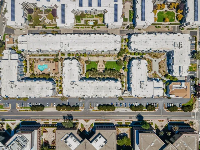 an aerial view of a house with a ocean view
