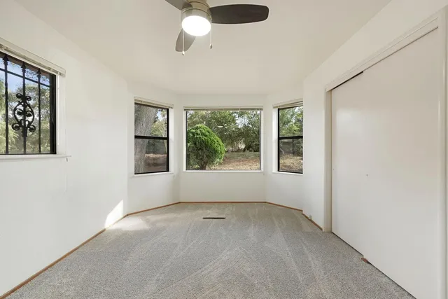 a spacious bathroom with a bathtub and window