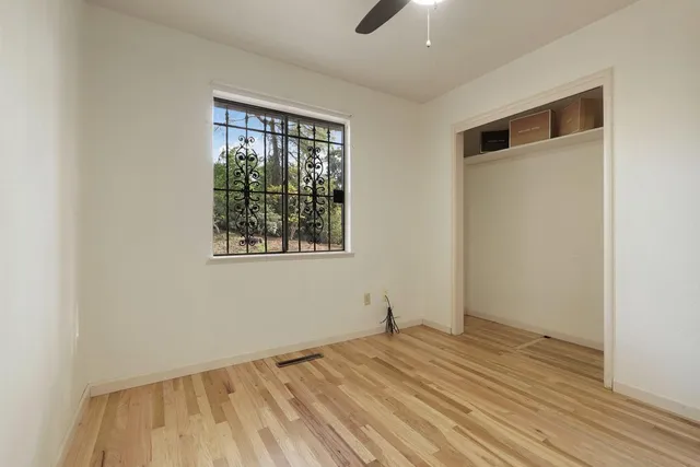 a bedroom with a large bed and a dresser