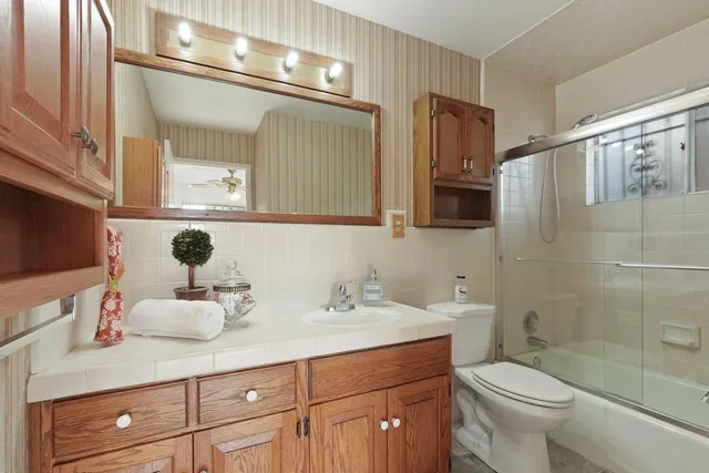 a building outdoor space with patio furniture and potted plants