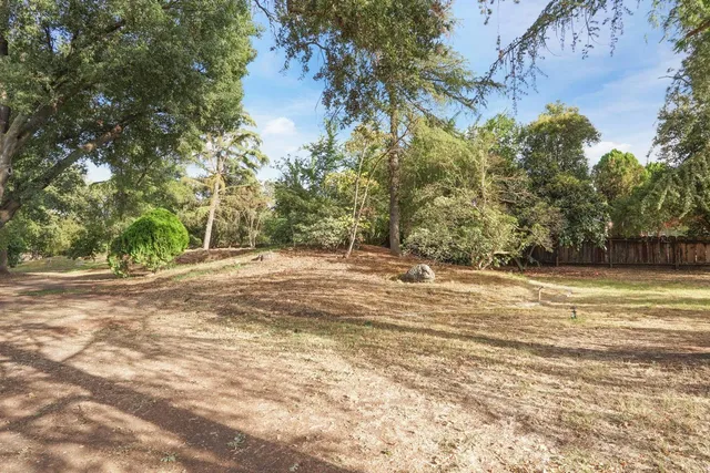 an aerial view of house with yard