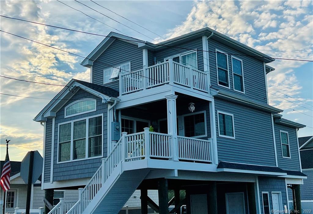 a view of wooden house with large windows