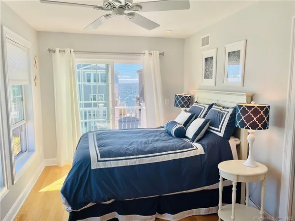 a bedroom with furniture and a window