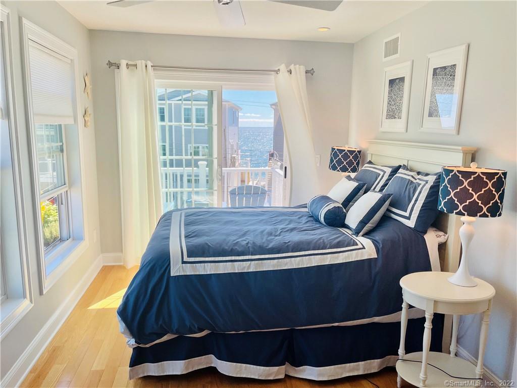 28 Beach Road West Old Saybrook, CT 06475 - Photo 19 of 22 a bedroom with a bed and window