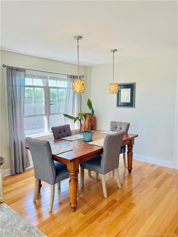 28 Beach Road West Old Saybrook, CT 06475 - Photo 2 of 22 a view of a dining room with furniture window and wooden floor