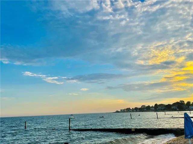 a view of wooden house with large windows