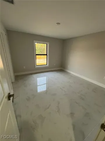 a bathroom with a double vanity sink toilet and mirror