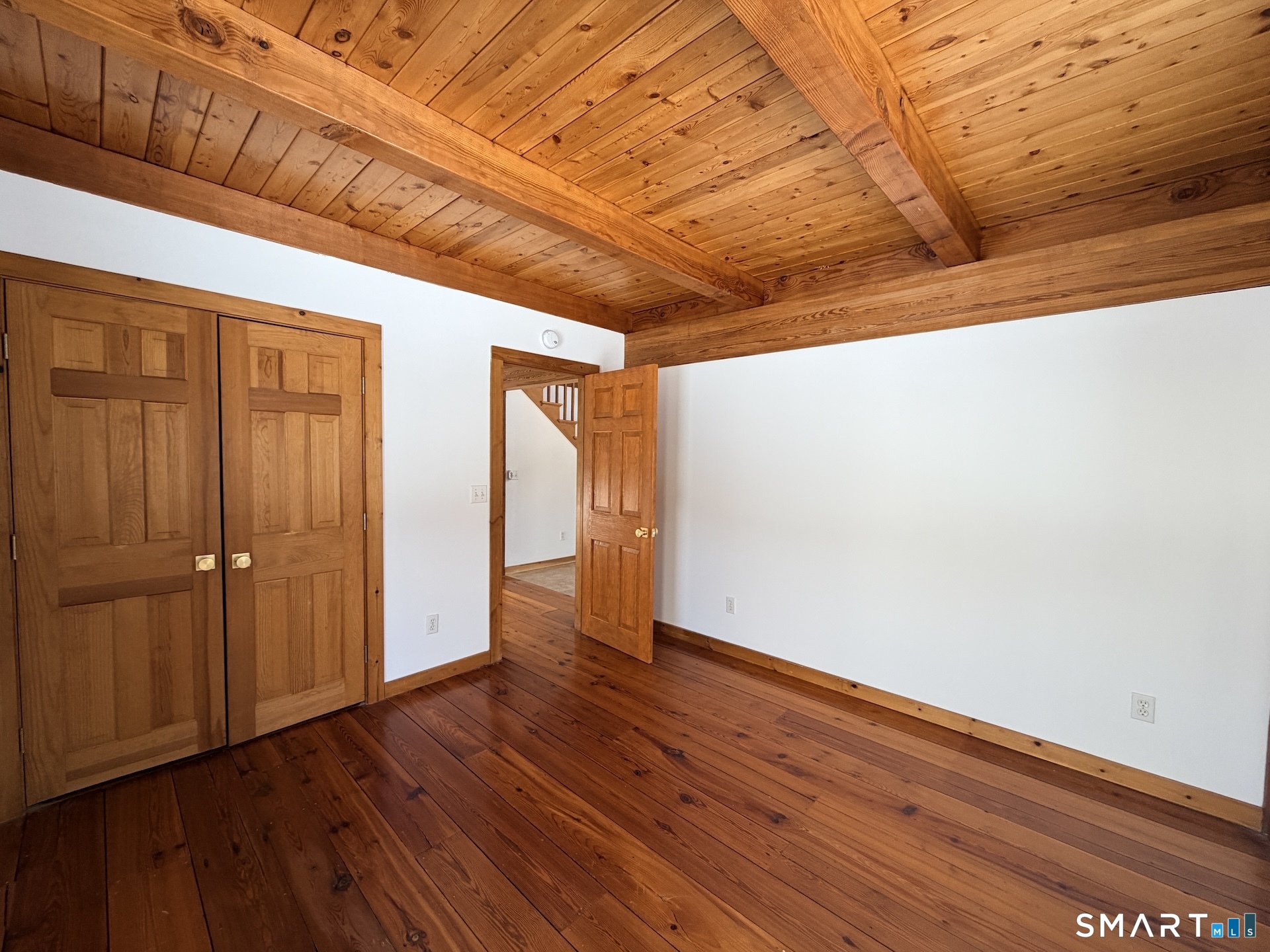 249 Woodbury Road Washington, CT 06793 - Photo 13 of 23 a view of hallway with wooden floor