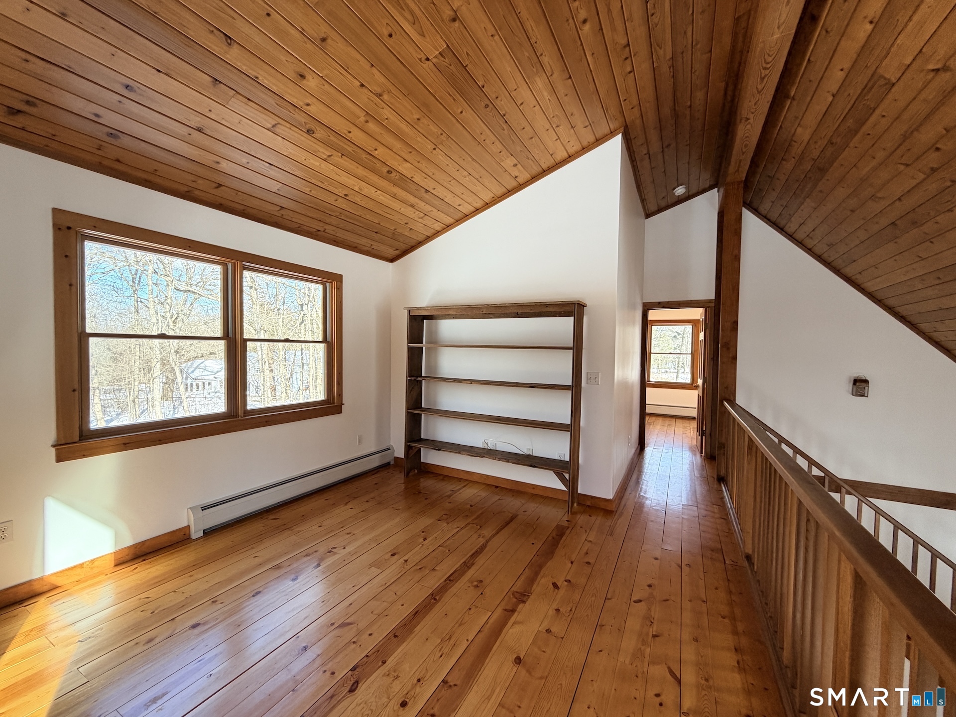 249 Woodbury Road Washington, CT 06793 - Photo 17 of 23 a view of empty room with wooden floor and fan