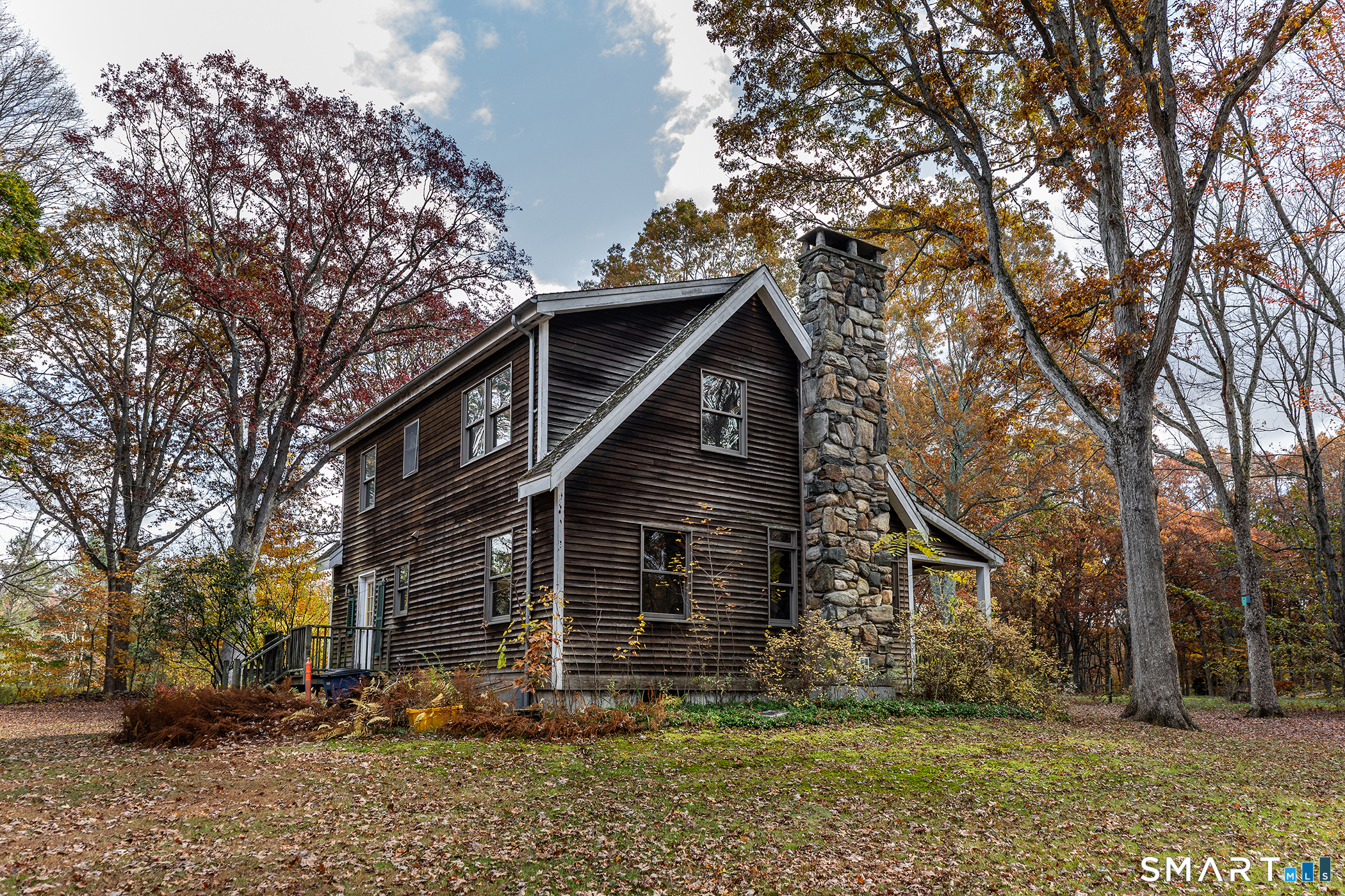 249 Woodbury Road Washington, CT 06793 - Photo 22 of 23 a view of a house with a yard