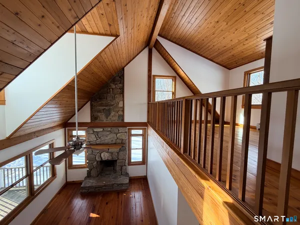 a view of entryway with wooden floor and stairs
