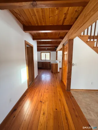 a view of a livingroom with wooden floor