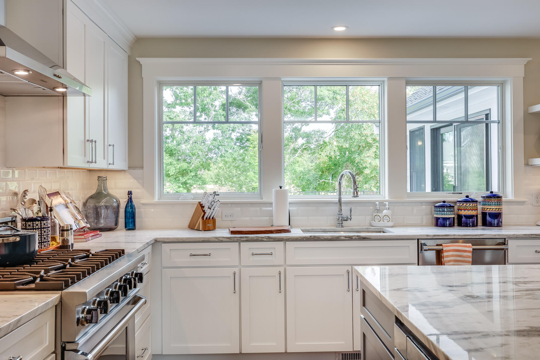 264 Tonset Road Orleans, MA 02653 - Photo 24 of 92 a kitchen with sink a window and cabinets