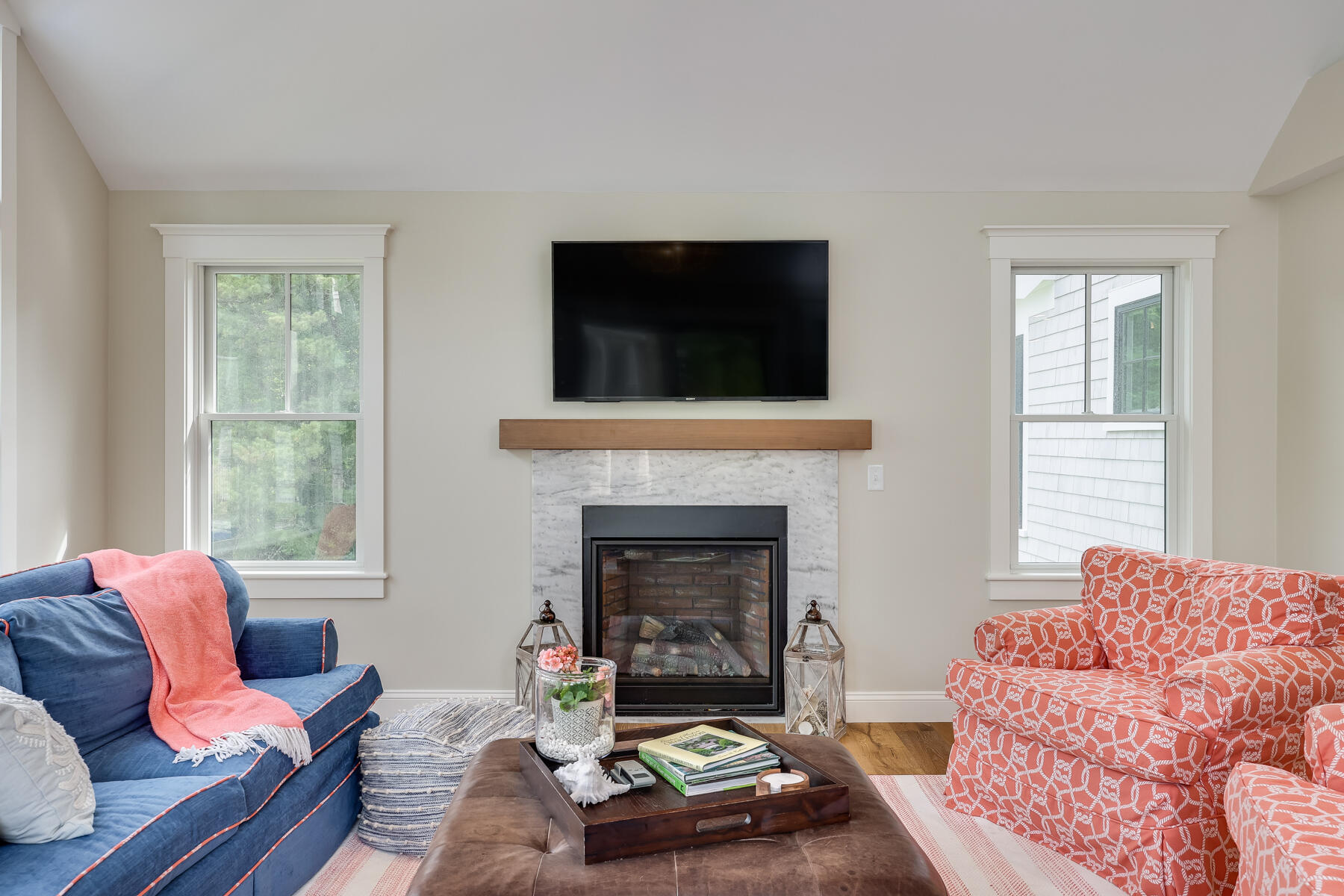 264 Tonset Road Orleans, MA 02653 - Photo 35 of 92 a living room with furniture and a fireplace