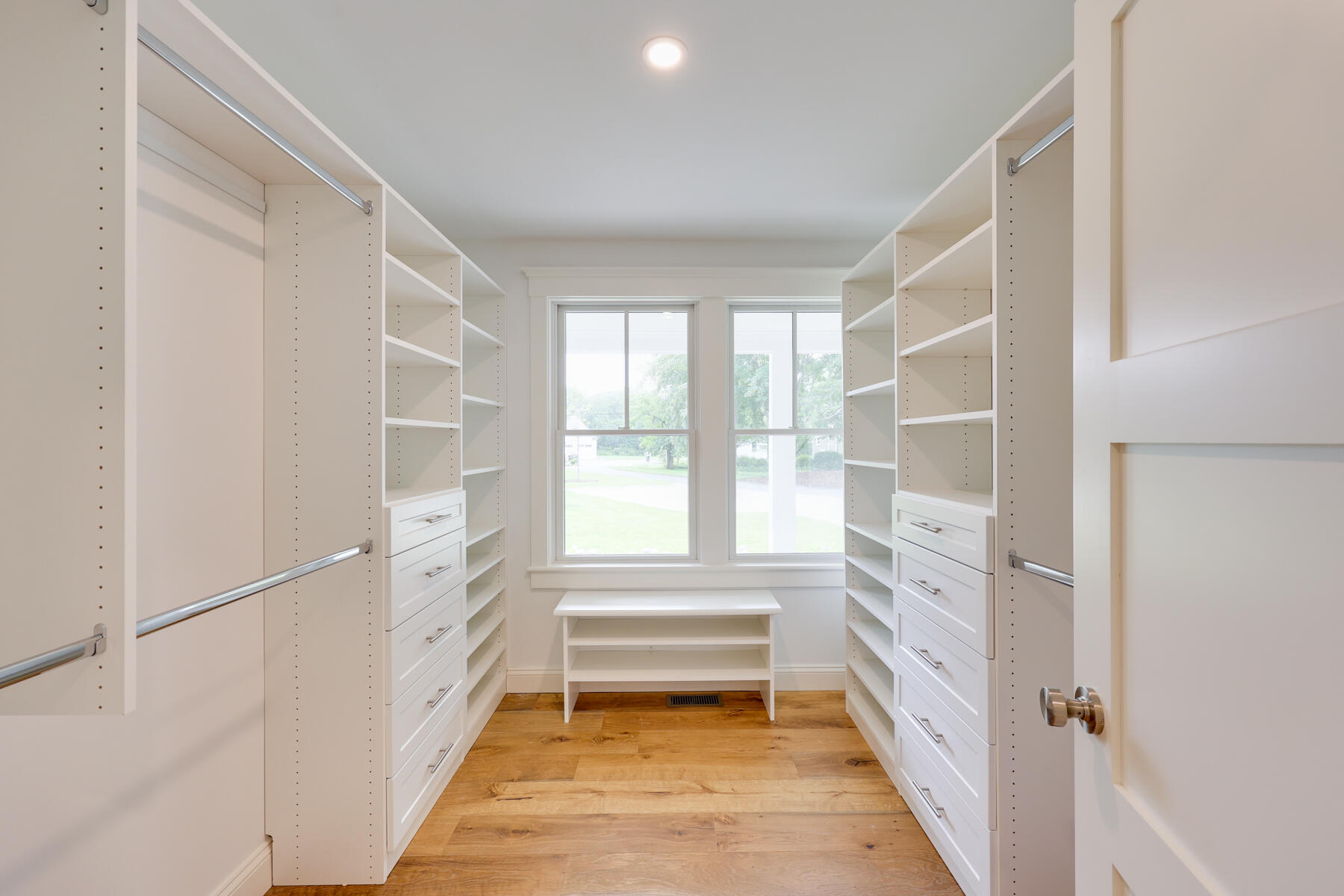 264 Tonset Road Orleans, MA 02653 - Photo 48 of 92 a hallway with white doors wooden floor and front door
