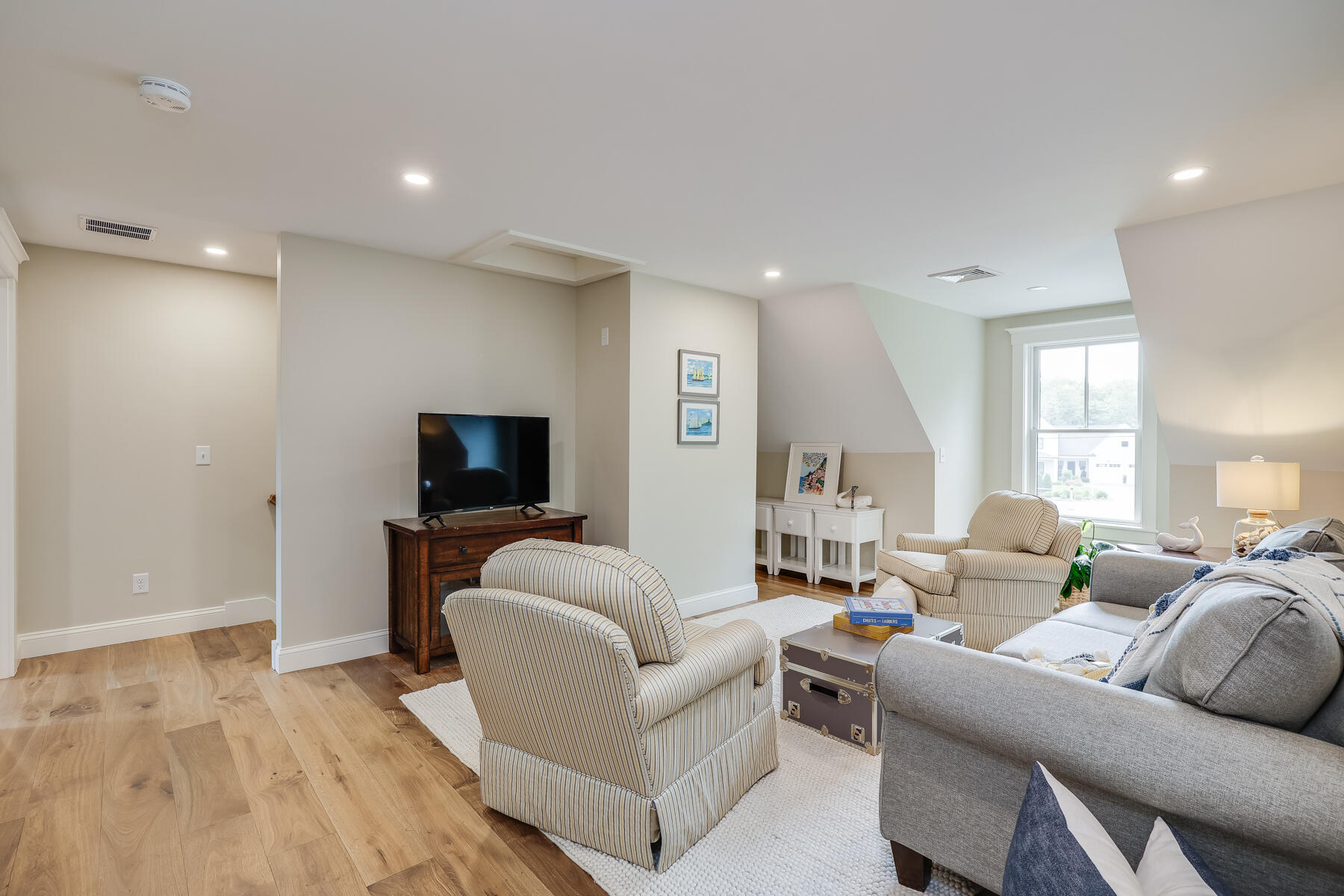 264 Tonset Road Orleans, MA 02653 - Photo 51 of 92 a living room with furniture and a flat screen tv