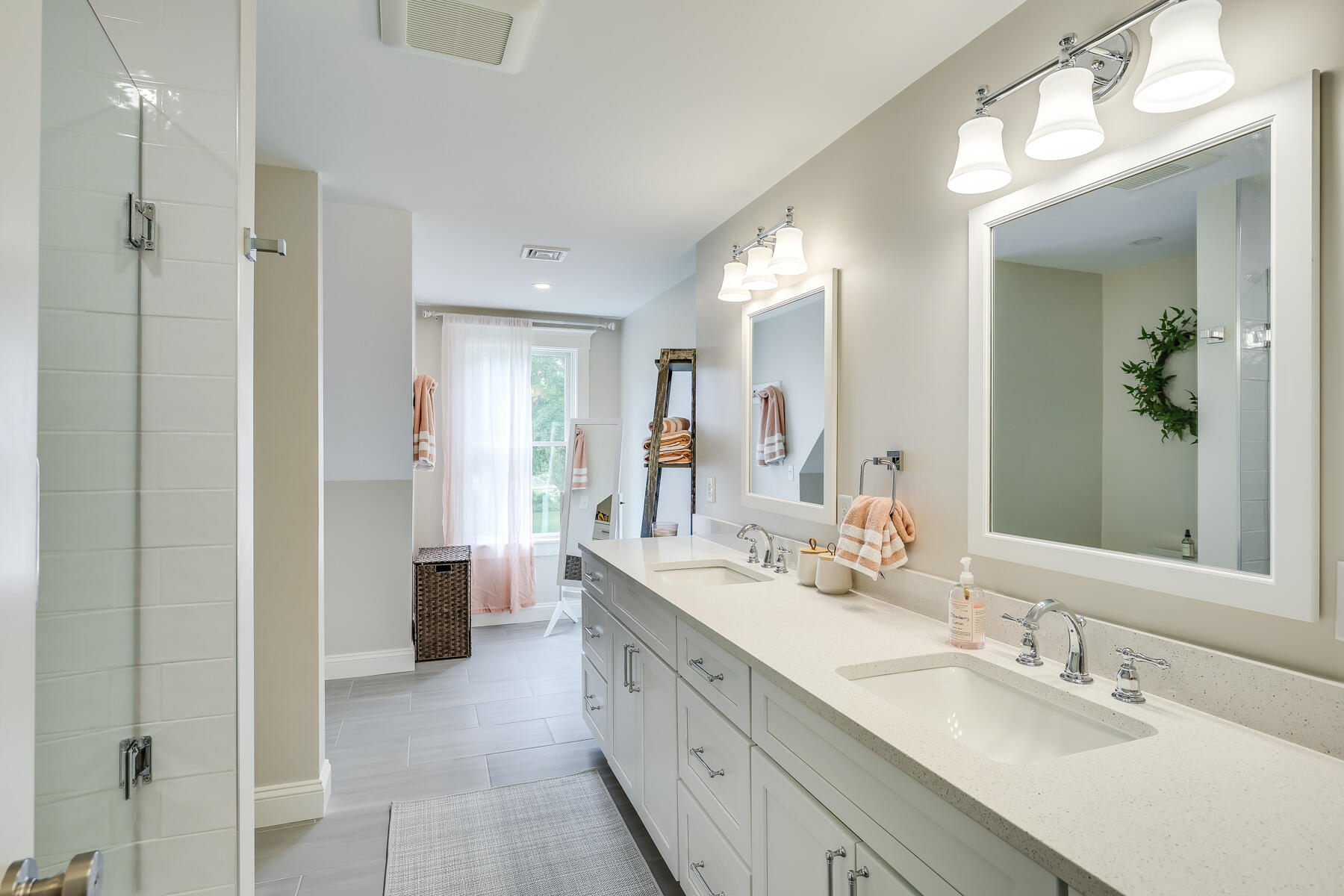 264 Tonset Road Orleans, MA 02653 - Photo 57 of 92 a spacious bathroom with a double vanity sink mirror and double