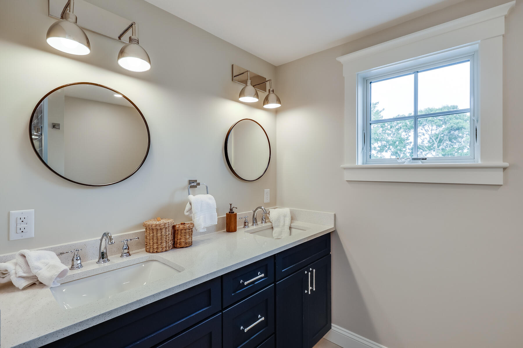 264 Tonset Road Orleans, MA 02653 - Photo 67 of 92 a bathroom with a double vanity sink and a mirror