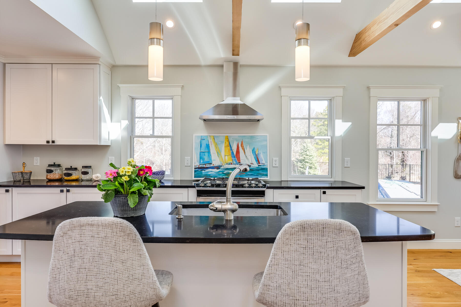 264 Tonset Road Orleans, MA 02653 - Photo 69 of 92 a kitchen with stainless steel appliances granite countertop a sink dishwasher and a flat screen tv
