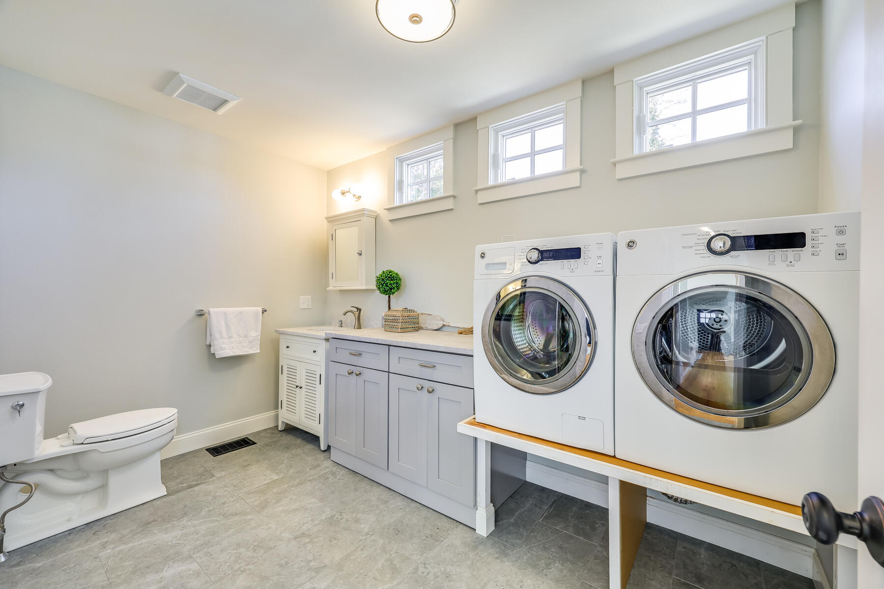 264 Tonset Road Orleans, MA 02653 - Photo 77 of 92 a utility room with sink dryer and washer