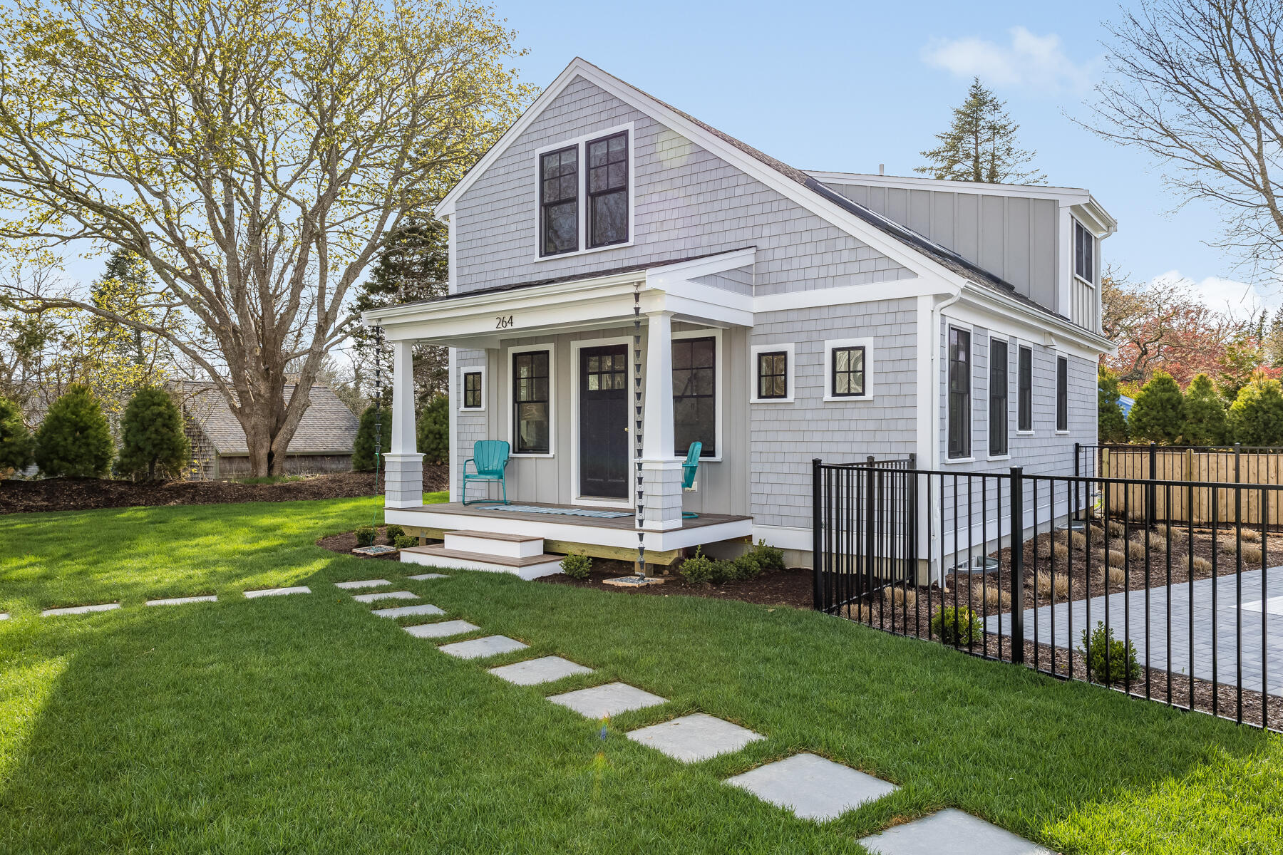 264 Tonset Road Orleans, MA 02653 - Photo 8 of 92 a view of a house with a yard and sitting area