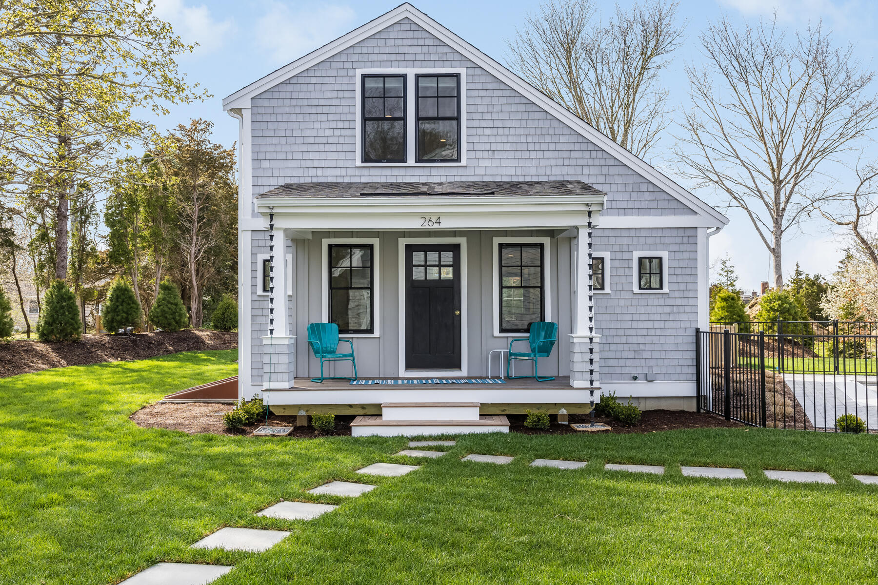264 Tonset Road Orleans, MA 02653 - Photo 85 of 92 a front view of a house with a yard