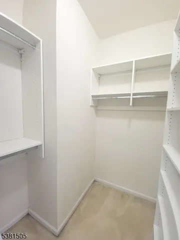 a view of an empty walk in closet