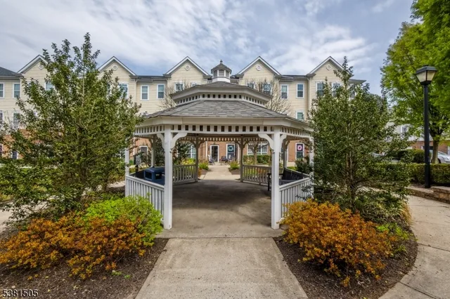 a view of a large building with a lot of flower plants