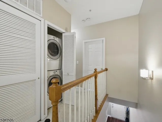 a view of a hallway with washer and dryer