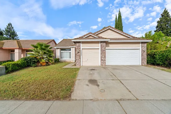 a front view of a house with yard