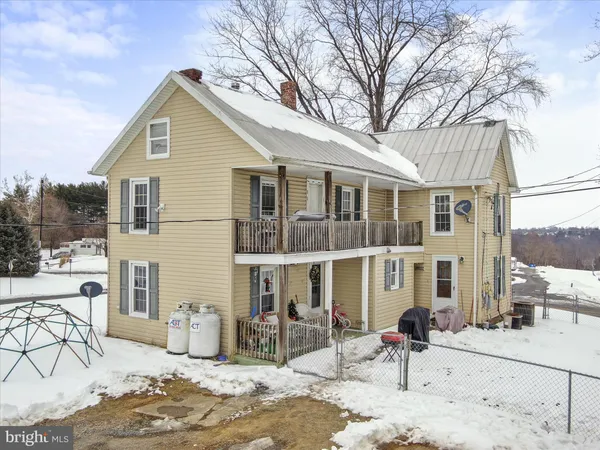 a front view of a house with patio