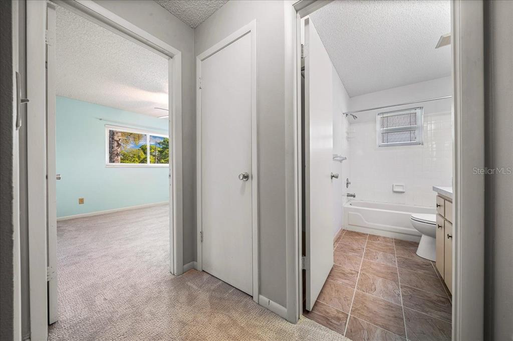 8702 Southwest 94 Street, Unit A Ocala, FL 34481 - Photo 13 of 55 a bathroom with a granite countertop toilet and a shower
