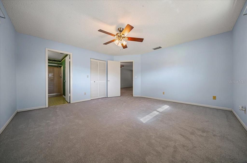 8702 Southwest 94 Street, Unit A Ocala, FL 34481 - Photo 20 of 55 a view of a kitchen with a ceiling fan and a ceiling fan