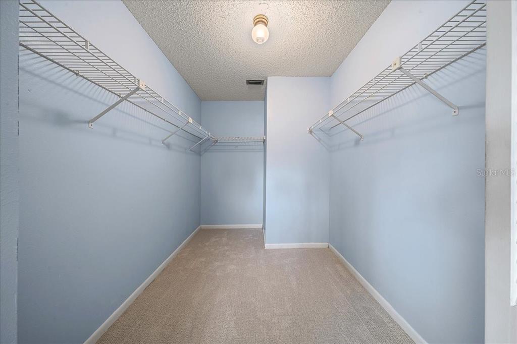 8702 Southwest 94 Street, Unit A Ocala, FL 34481 - Photo 22 of 55 a view of a room with racks on the wall