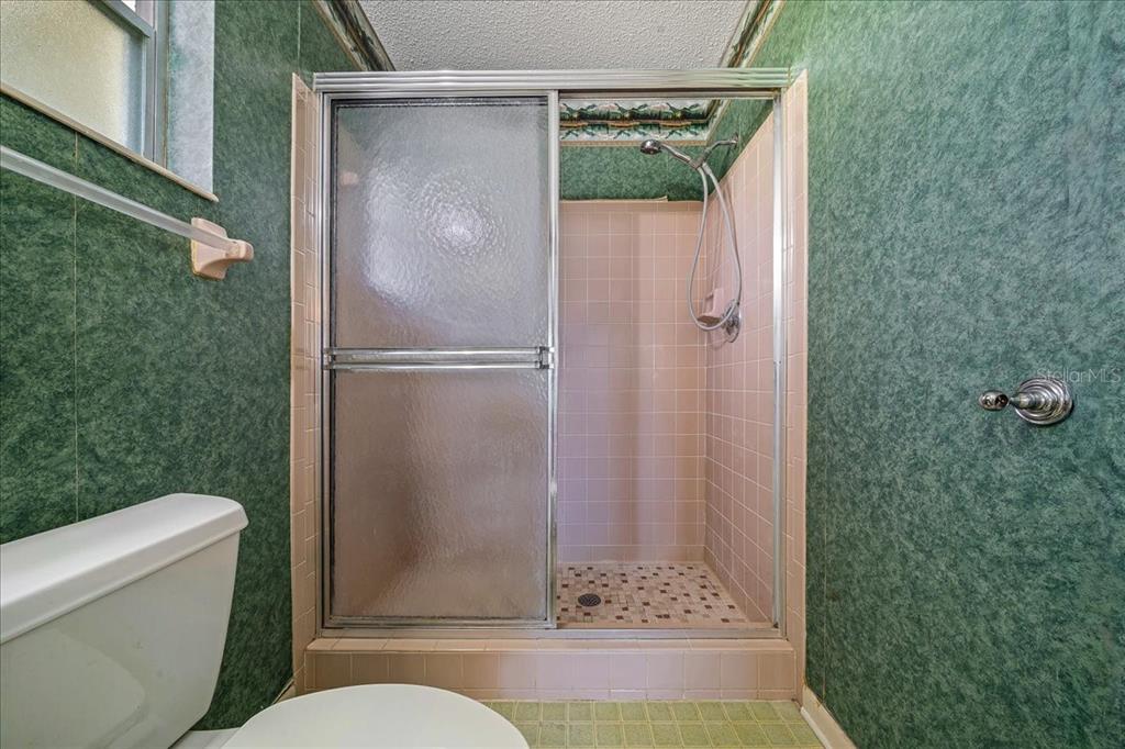 8702 Southwest 94 Street, Unit A Ocala, FL 34481 - Photo 24 of 55 a bathroom with a shower and a toilet