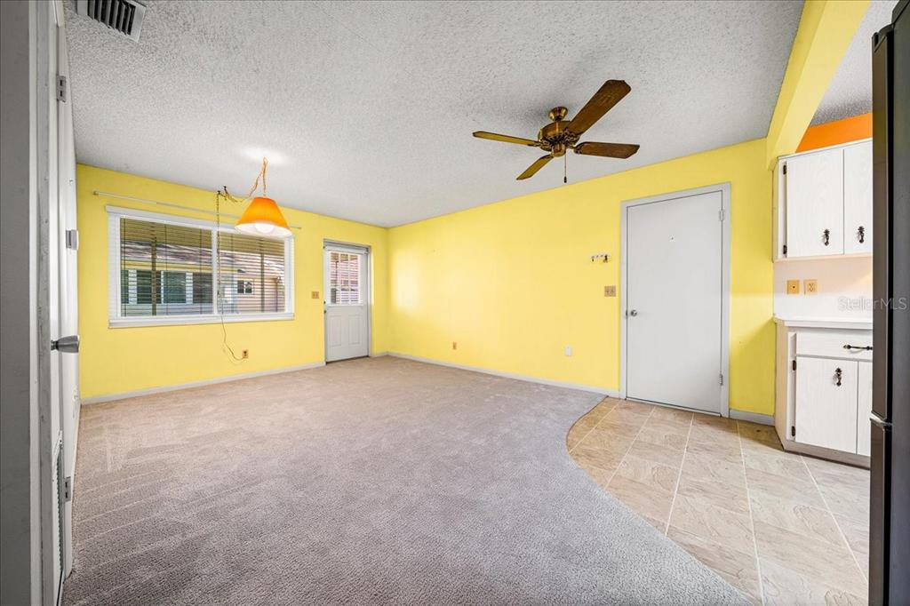 8702 Southwest 94 Street, Unit A Ocala, FL 34481 - Photo 26 of 55 a view of a big room with wooden floor and windows