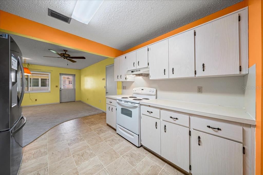 8702 Southwest 94 Street, Unit A Ocala, FL 34481 - Photo 33 of 55 a kitchen with cabinets and appliances