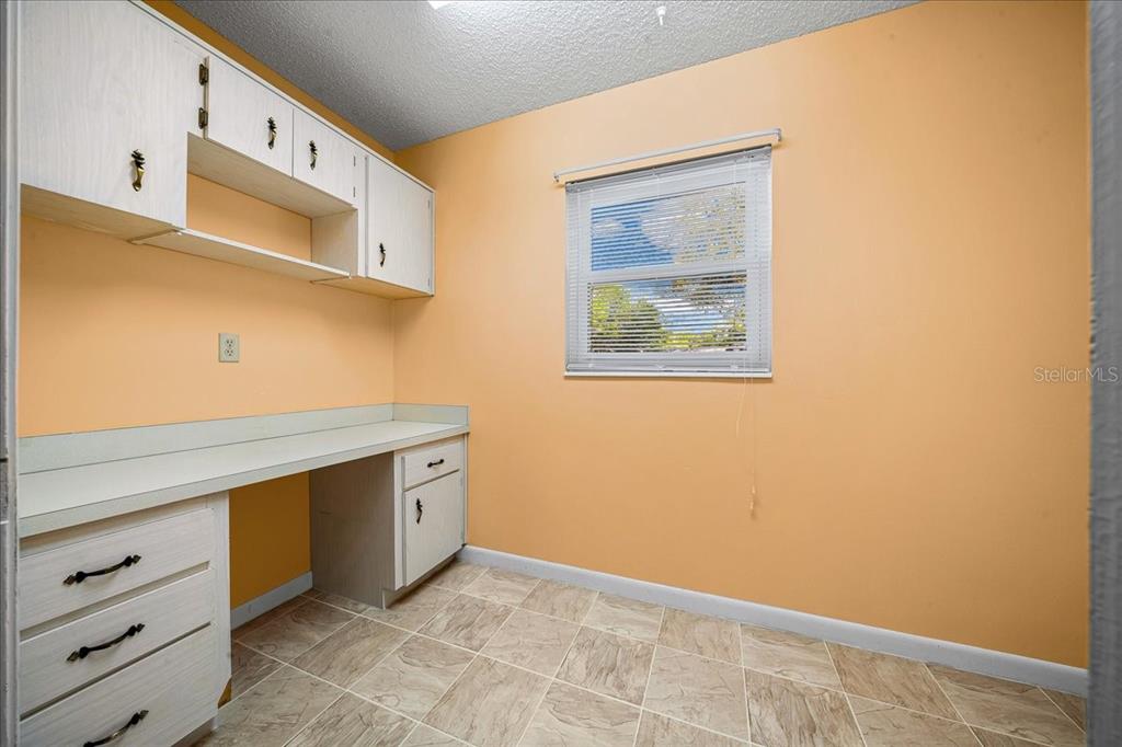 8702 Southwest 94 Street, Unit A Ocala, FL 34481 - Photo 35 of 55 a view of cabinets with wooden floor